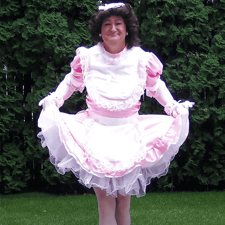 Attractive Man Wearing Makeup And Pink Dress Looks Like As A Woman