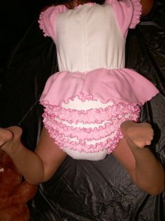 A Sissy Girl wearing the Baby Print Adult Diaper with Baby Fresh Scent Loud Plastic Abdl