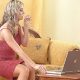 A cute hot girl sitting and working with a laptop