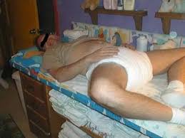 A Old Man Lying Down in Bed and wearing big diaper