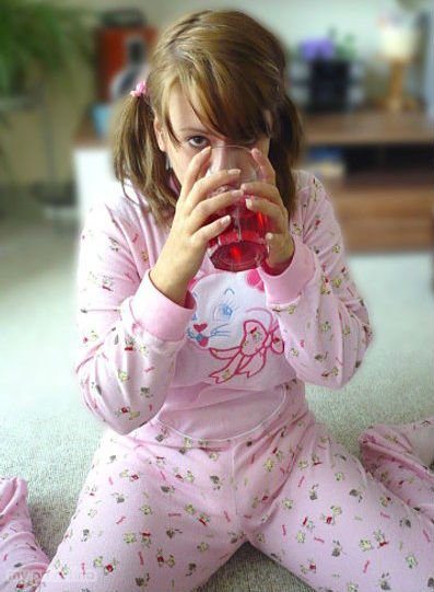 Adult Teen Girl Holding Glass Full Juice and Drinking