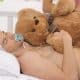Young Man Sleeping With A Teddy Bear