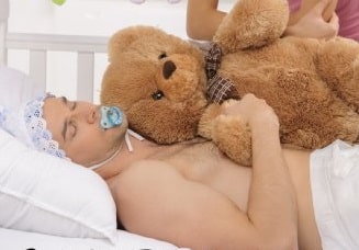 Young Man Sleeping With A Teddy Bear