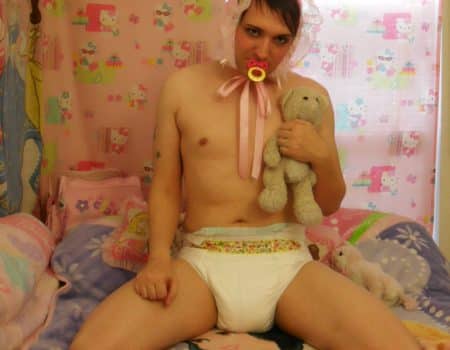 Teen Boy wearing the diaper and also sucking the pacifier