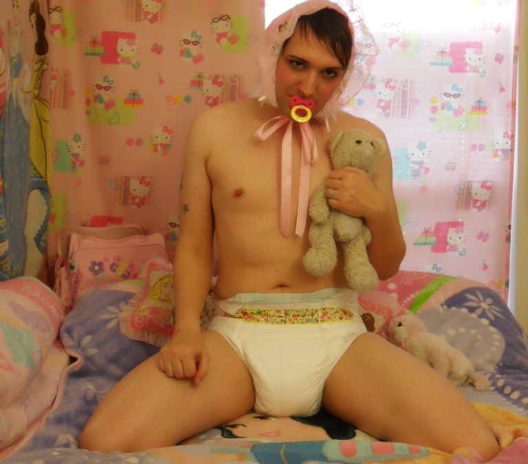 Teen Boy wearing the diaper and also sucking the pacifier