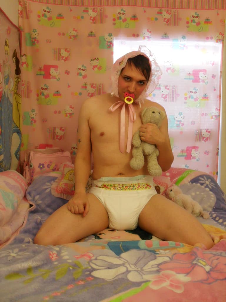 Teen Boy wearing the diaper and also sucking the pacifier