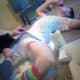 Mom Removing The Diaper While He sleeping on the floor