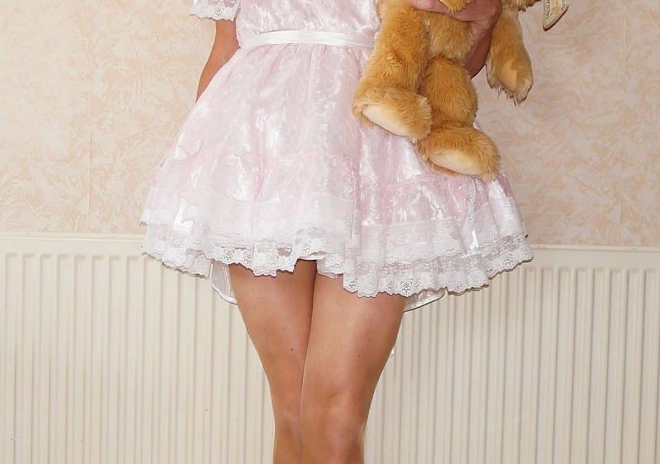 Cute Little Girl With Teddy Bear At Home