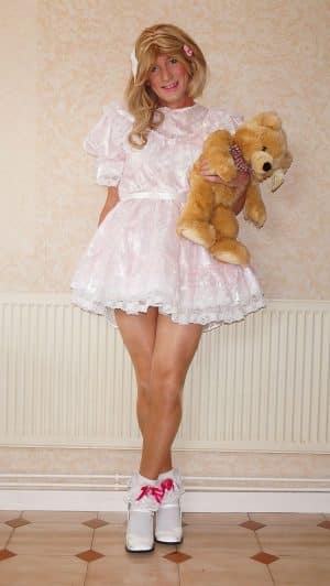 Cute Little Girl With Teddy Bear At Home