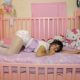 Charming Attractive Girl Lying On Stomach In Bed