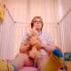 Old granny As Baby Child In Diaper With Teddy Bear