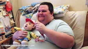 Smiley Fat man holding the toy with his hand