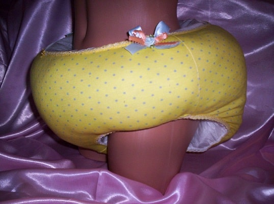 Naked teen wearing the waddle yellow diaper