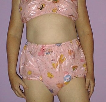 Teenage Girl wearing The plastic diaper and Shows Them
