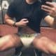 Young Man Taking diaper Selfie In Front Of Mirror At Home