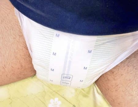 Boy wearing the baby adult wet diaper