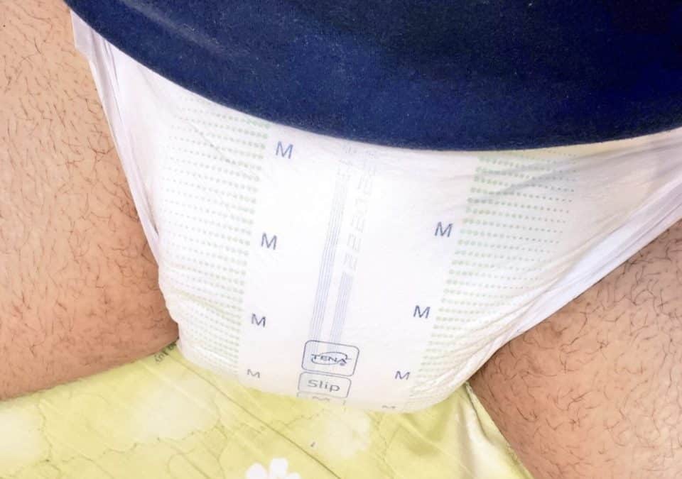 Boy wearing the baby adult wet diaper