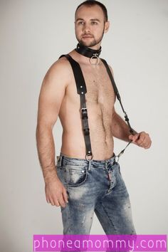 Male submissive in suspenders with no shirt
